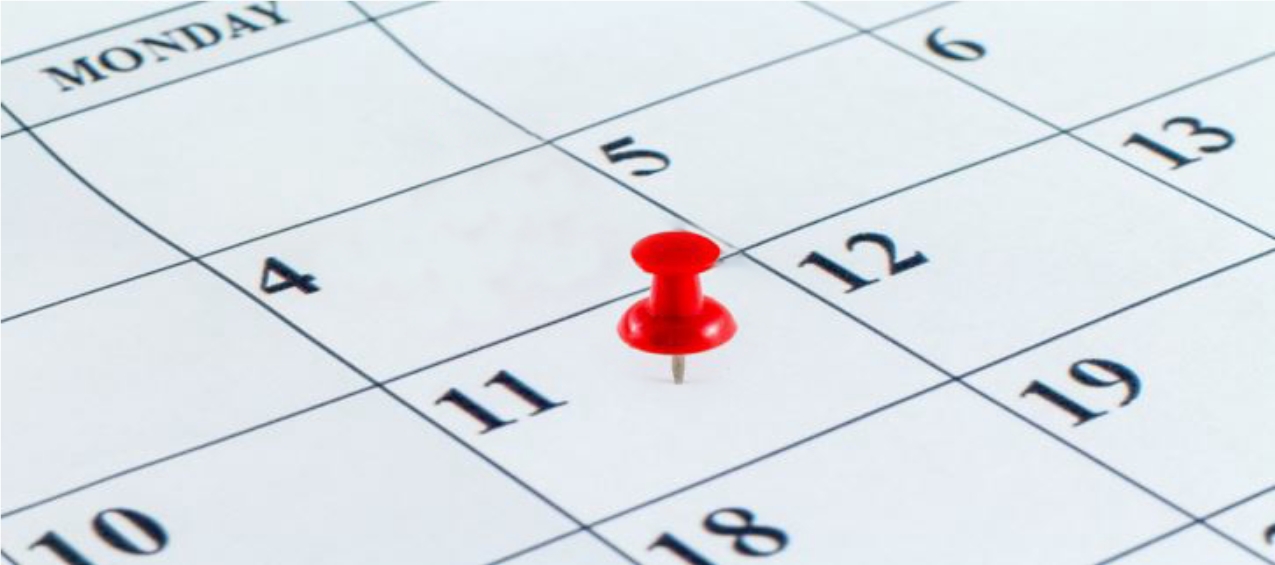 calendar with red thumbtack marking a date