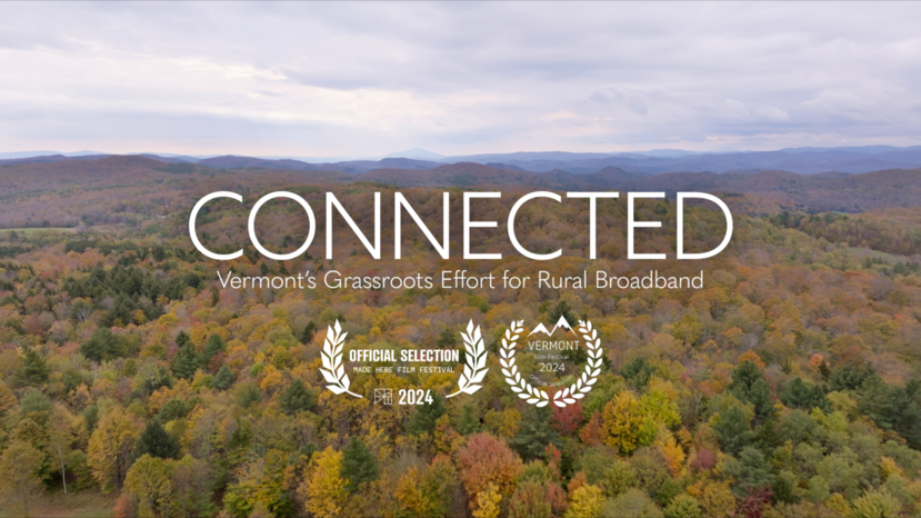 View from above of trees with fall colors and the documentary title "Connected"